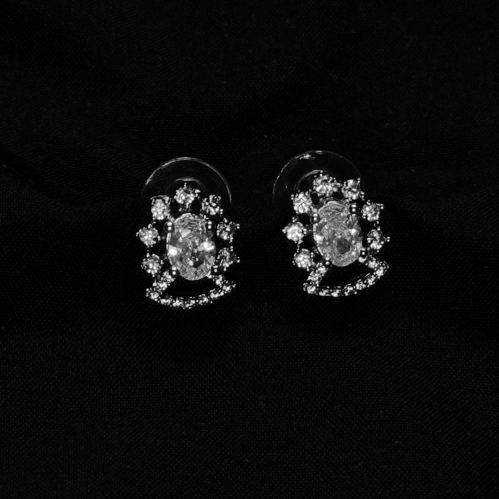 Pair of diamond earrings on a black background