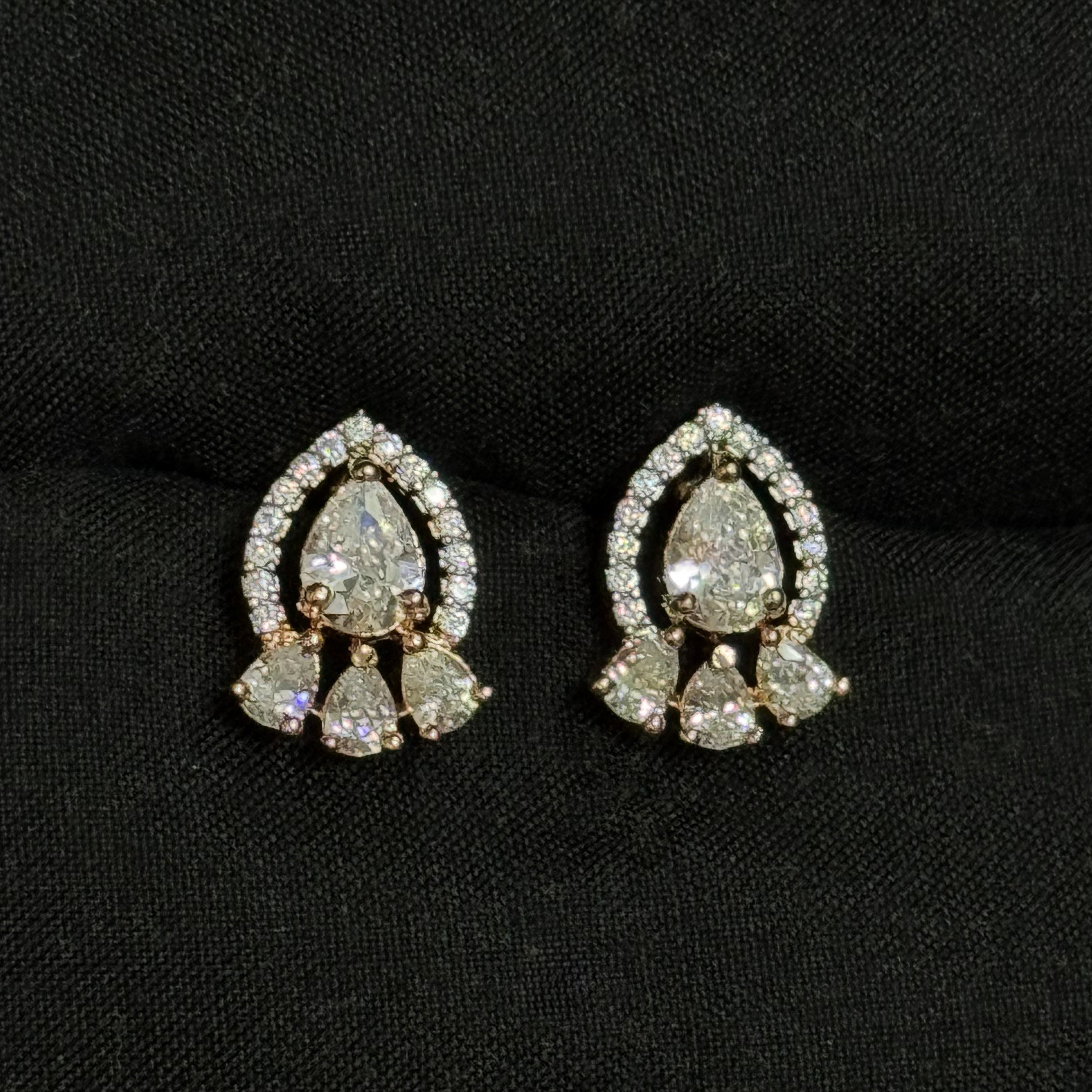 Pair of diamond earrings on a black background