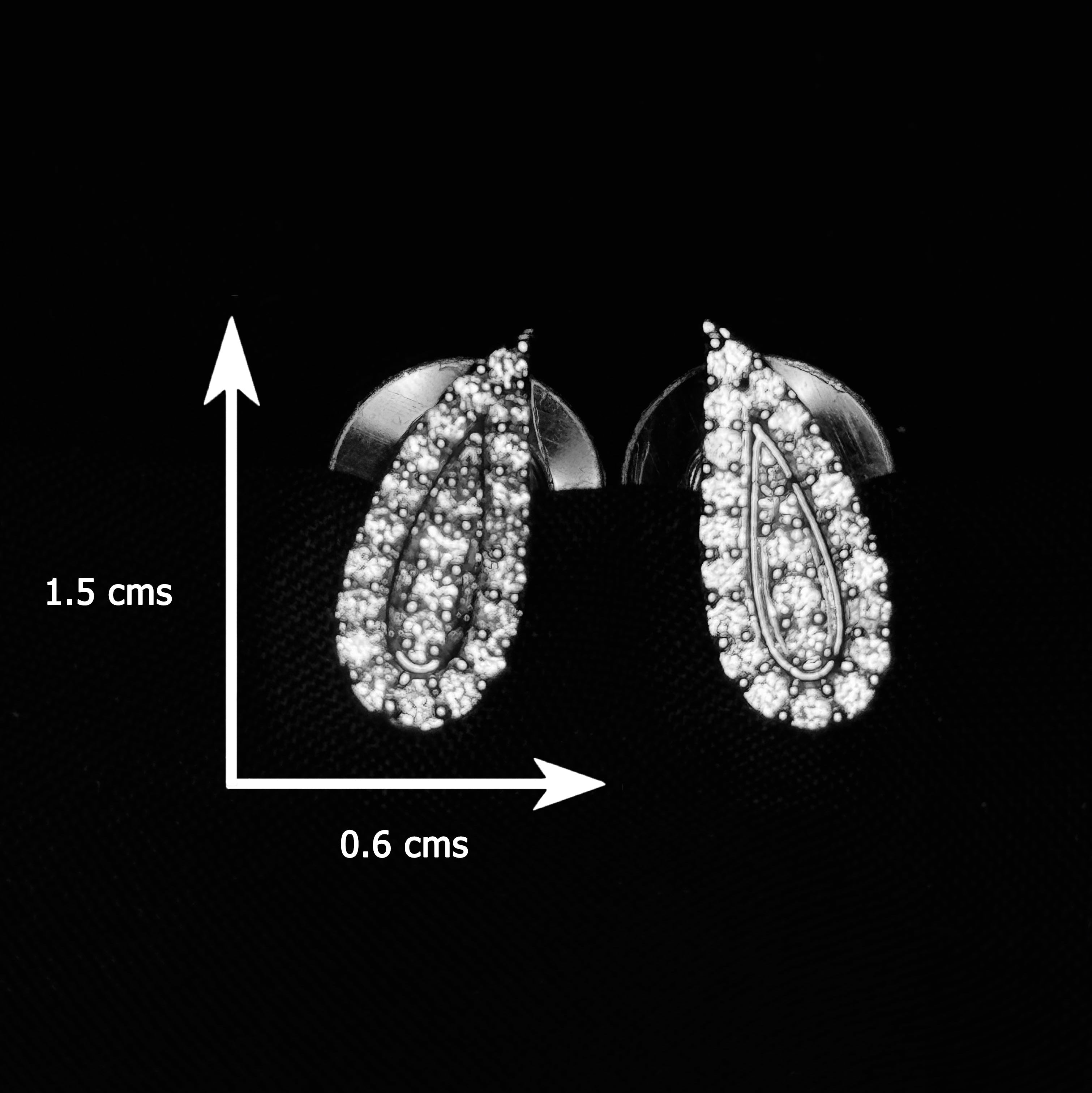 Pair of silver earrings with clear stones on a black background, showing dimensions.